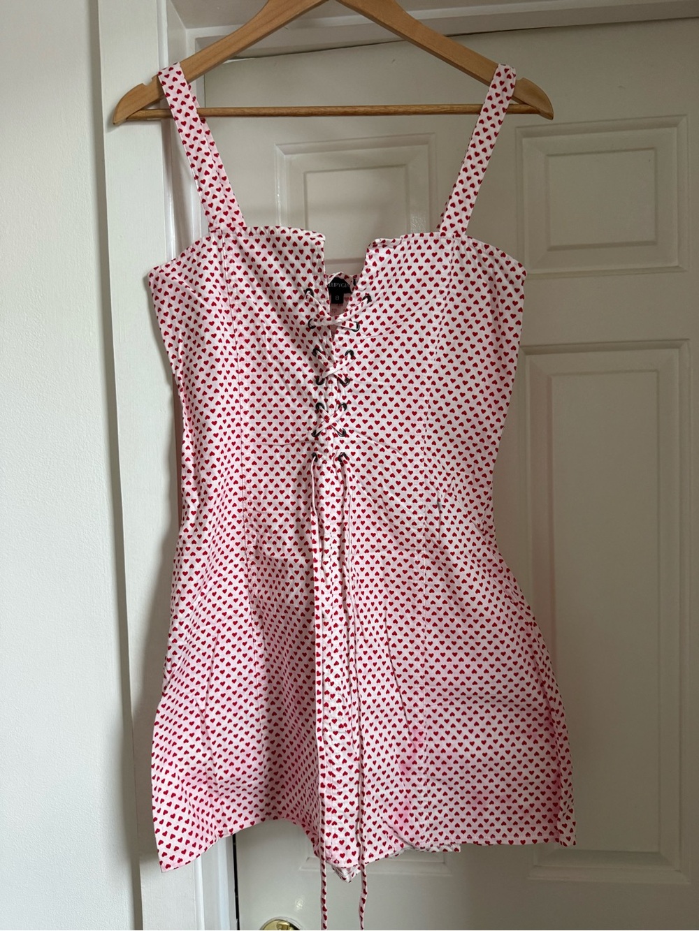 White Mini Dress with Red Heart Print and Front Lace-Up by Callipygian